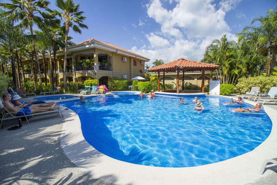 Pool area with pool for adults, kids and one jacuzzi.