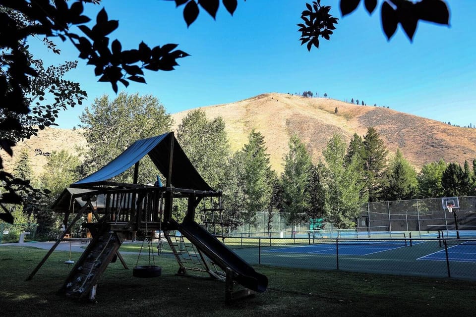 Tennis courts and childrens play area