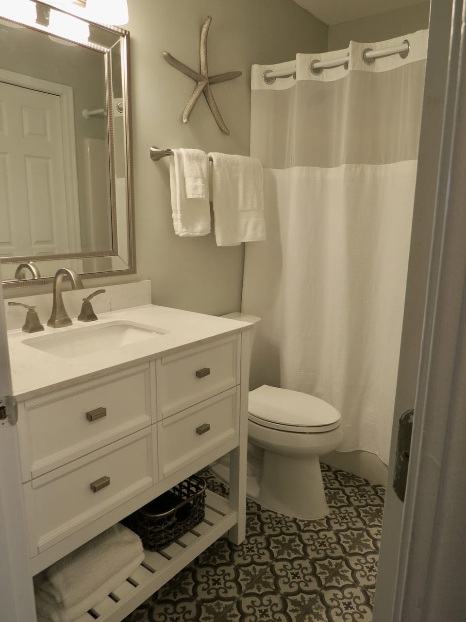 Newly renovated second bathroom off the hall and guest room.