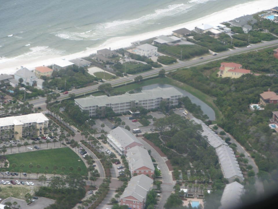 Nearest beach access is between left and center semi-circular driveway.