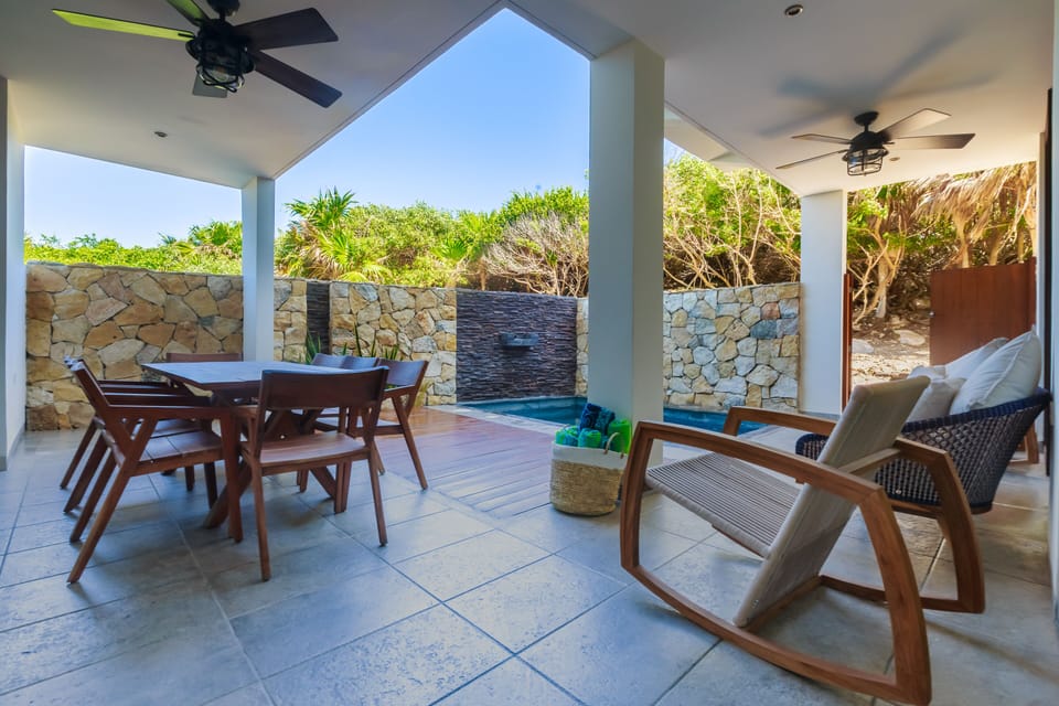 Level 1 - Private Patio with dining table, outdoor seating & private pool 