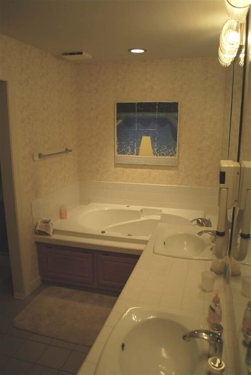 The master bath has a jetted tub, a double vanity, and a walk-in shower.