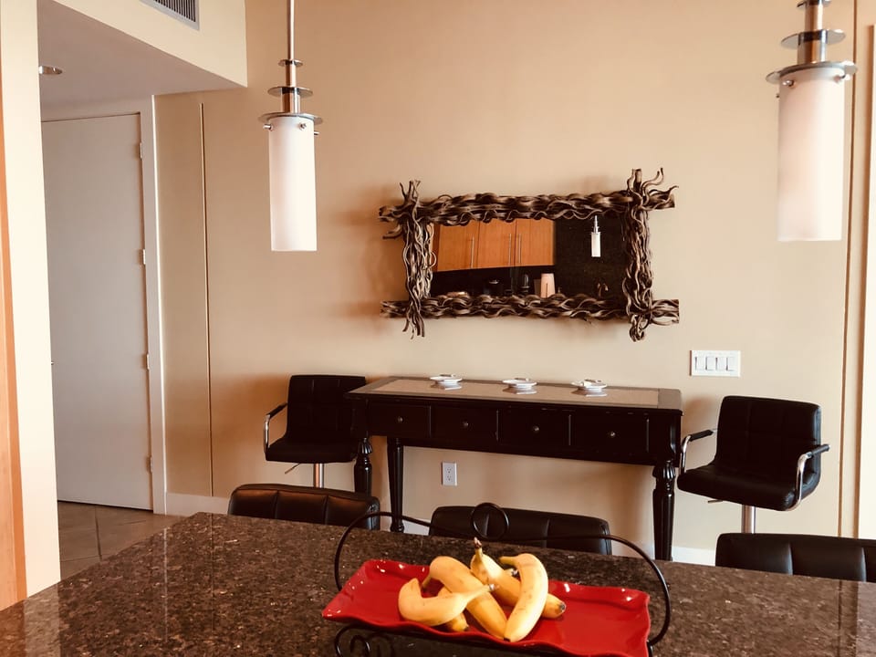 Side table opens with a leaf to add additional dining seating!