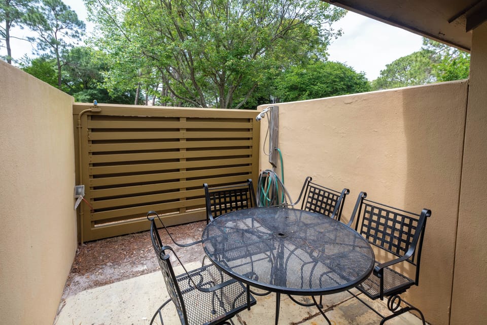 Quiet seating on the enclosed patio outside downstairs bedroom.