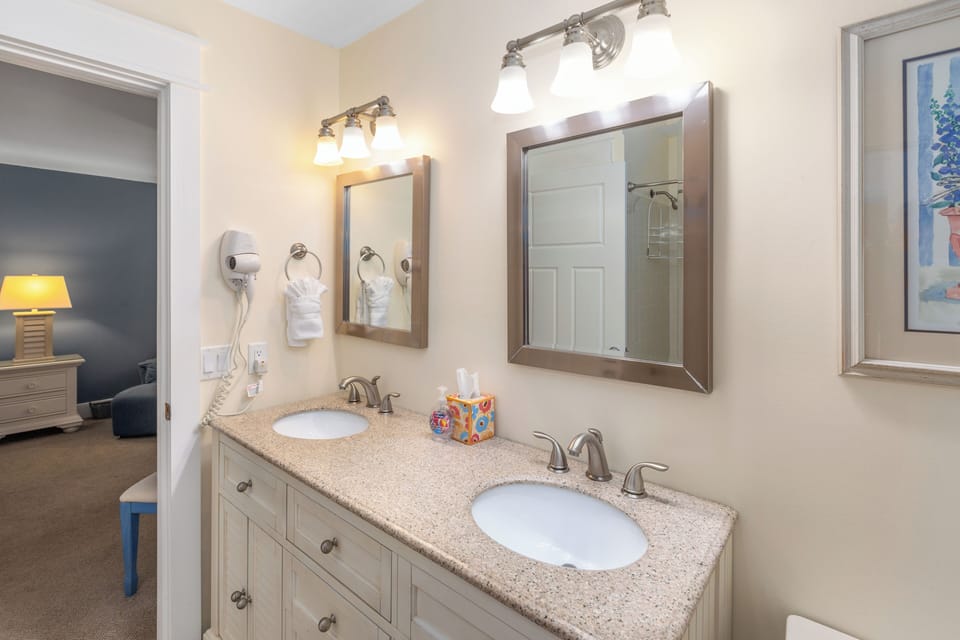 Double sink in private master bath. Hair dryer is provided.