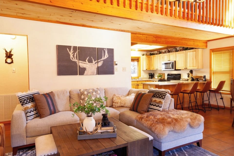 Unwind in your cozy retreat where rustic wood beams meet modern comfort. Sink into plush seating, whip up meals in your well-equipped kitchen, and feel at home in this thoughtfully designed space.