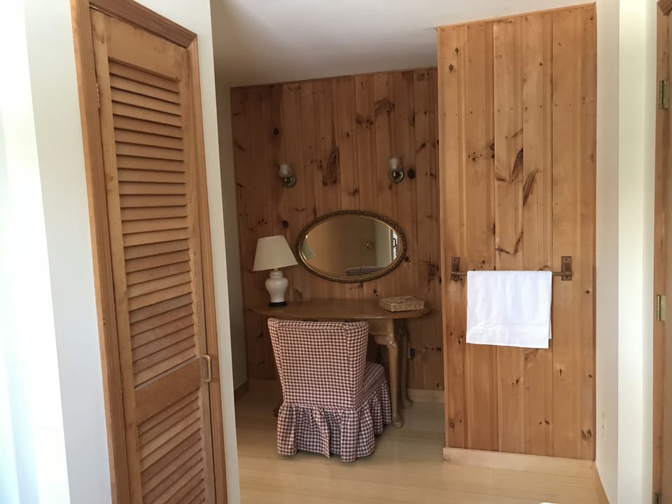 Upstairs bathroom with bathtub and makeup alcove 
