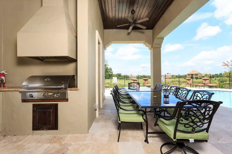 Grill & outdoor seating overlooking the pool