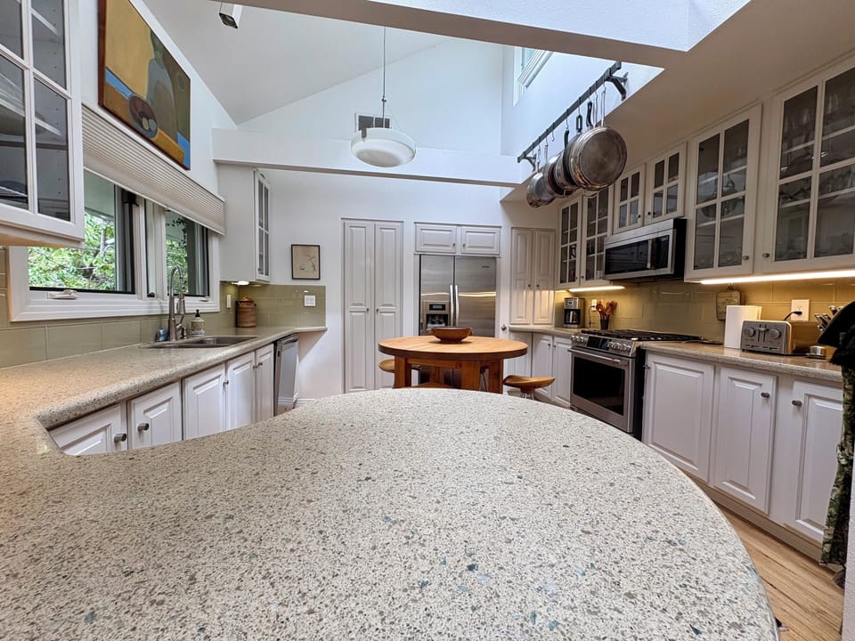 Kitchen with plenty appliances for those who love to cook