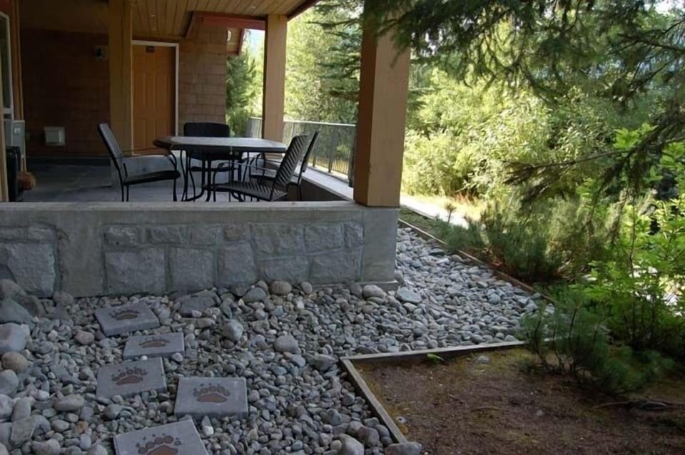 One patio with table, other with our hot tub.