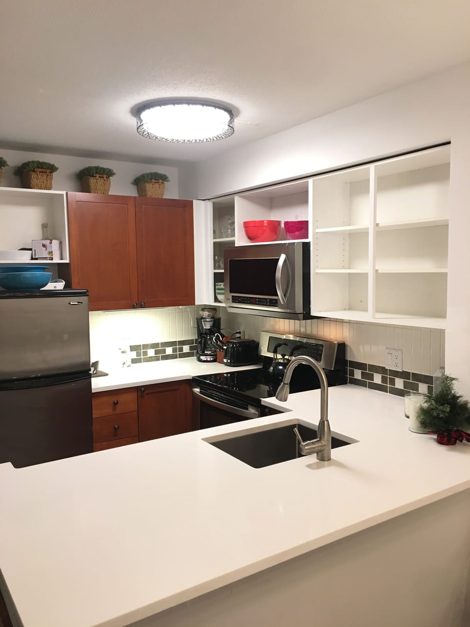 Kitchen overview, new counters and cabinet doors put on after photo