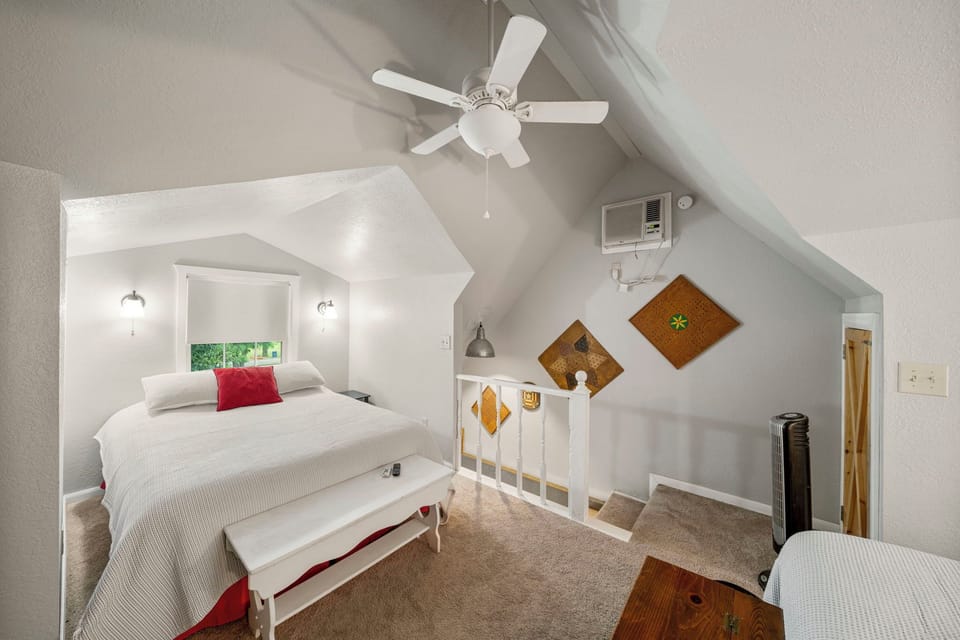 upstairs loft bedroom with 2 queen beds