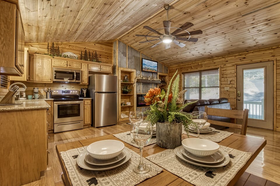 Cabin in Pigeon Forge "Honeymoon Hideaway" - Dining table and fully furnished kitchen