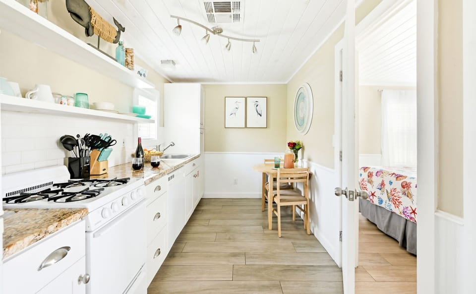 Kitchen and dining area with direct access to the bedroom.