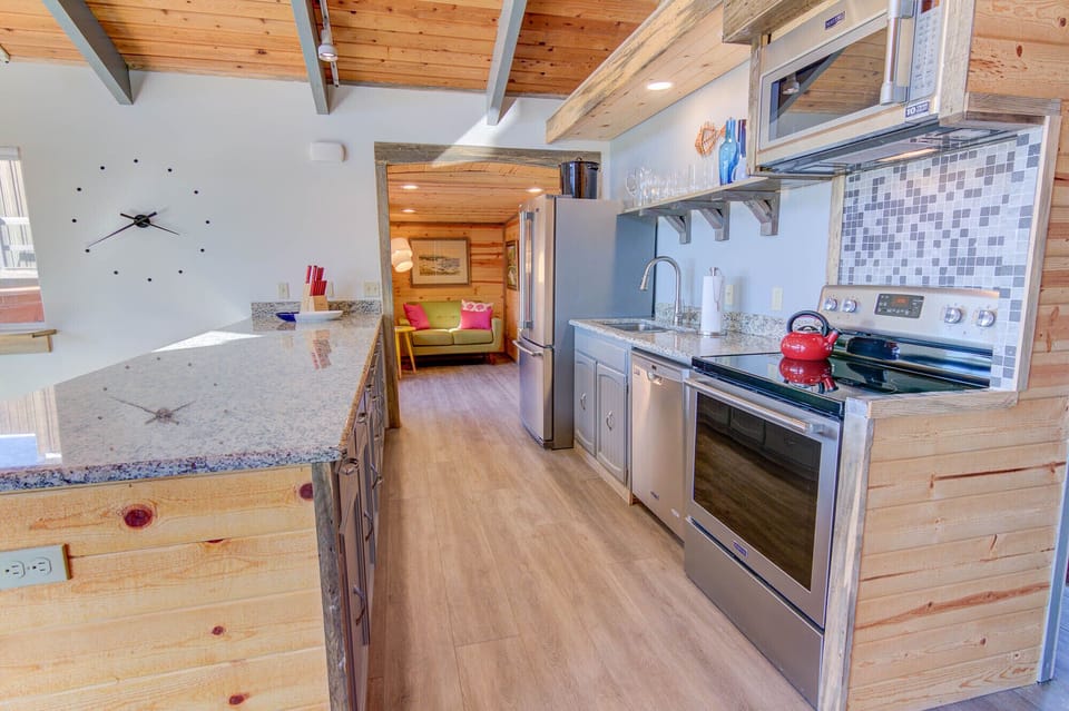 Galley kitchen with new appliances great for preparing family meals.