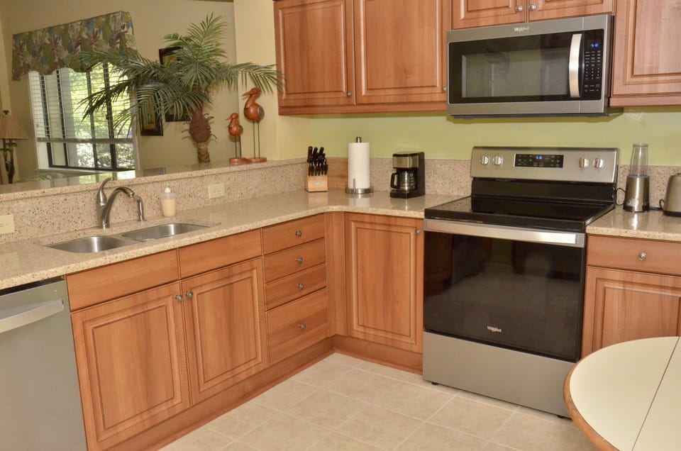 Our updated kitchen with new stainless steel appliances and quartz countertops. 