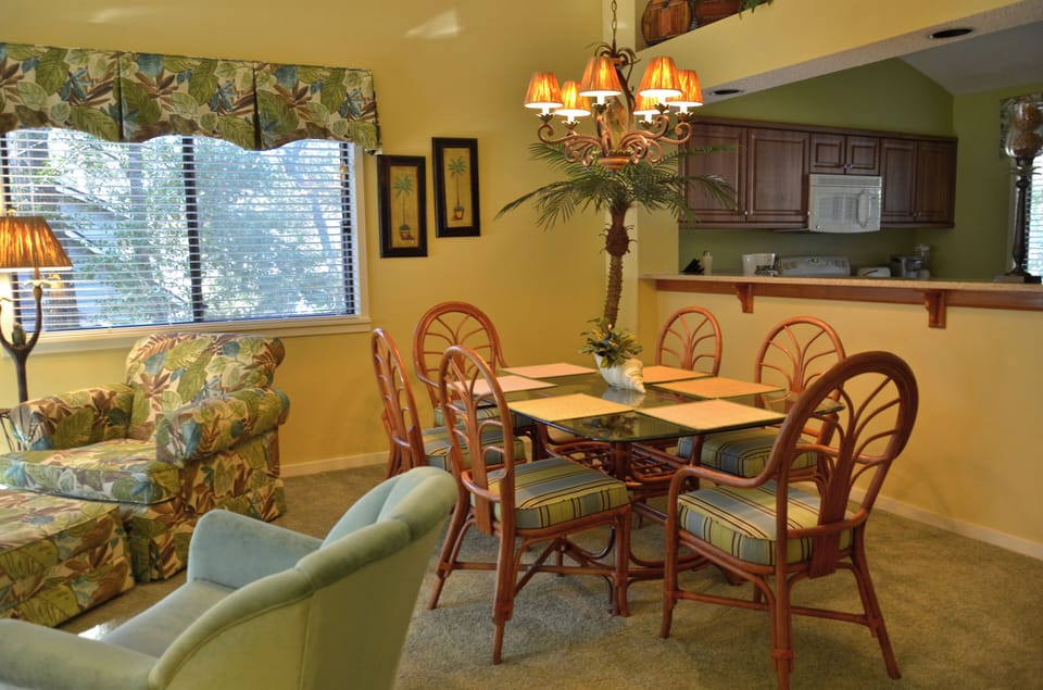 The tropical themed dining area comfortably seats 6 people.