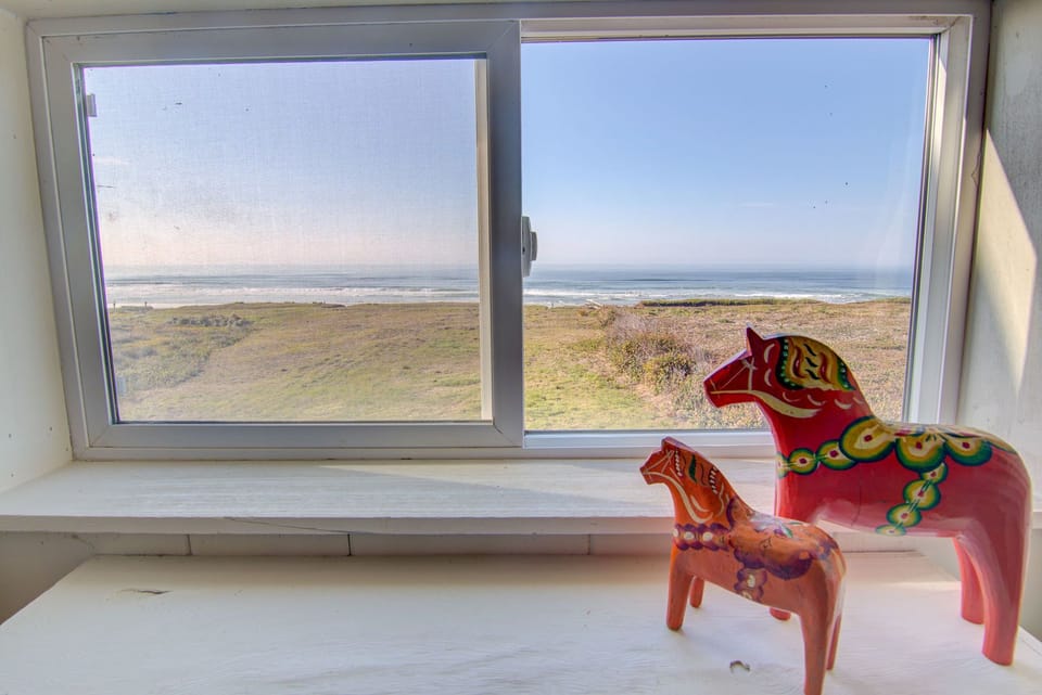 Peek out the upstairs king bedroom to see the ocean.