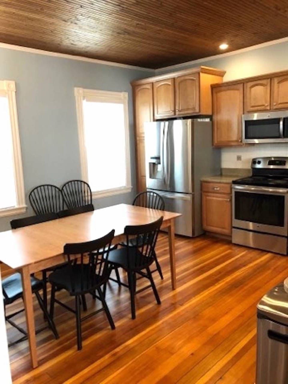 Kitchen /w stainless steel appliances, granite countertops and Shaker furniture.
