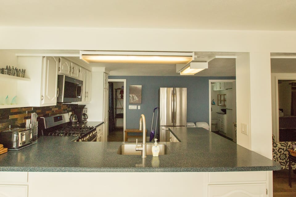 Kitchen view from by sliding glass door to deck