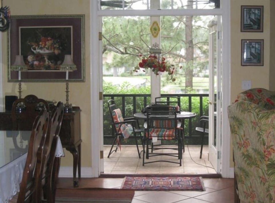 View from Family room/Dining area to outside to the pond and golf course.