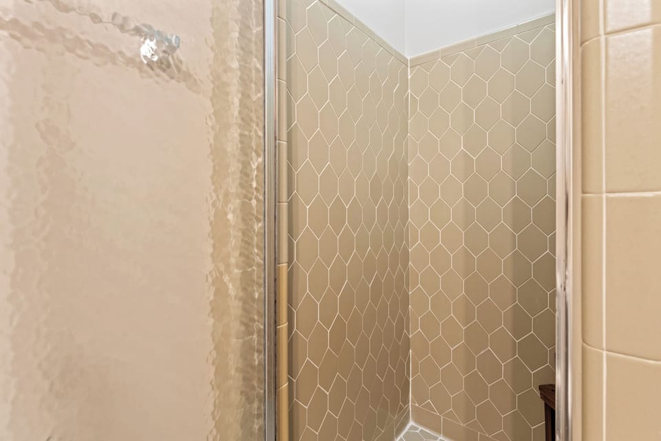 Guest bathroom #2 in the hallway with glass standing shower