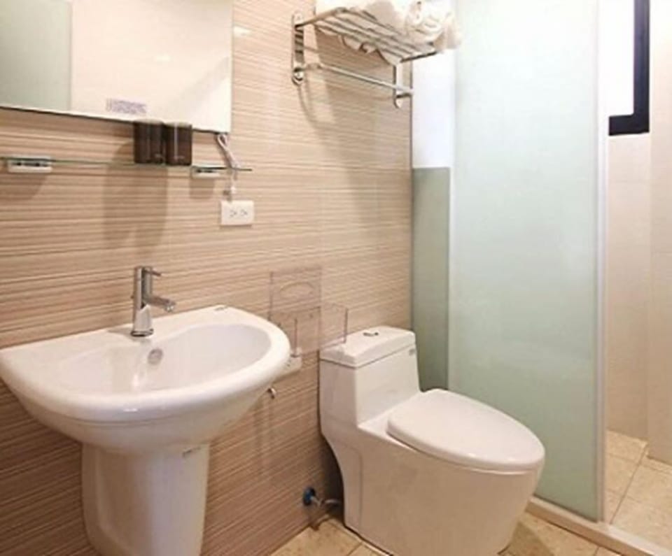 Shower, free toiletries, hair dryer, slippers