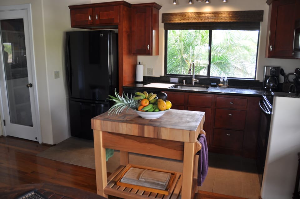 Pantry, refrigerator, cherry cupboards provide lots of storage space