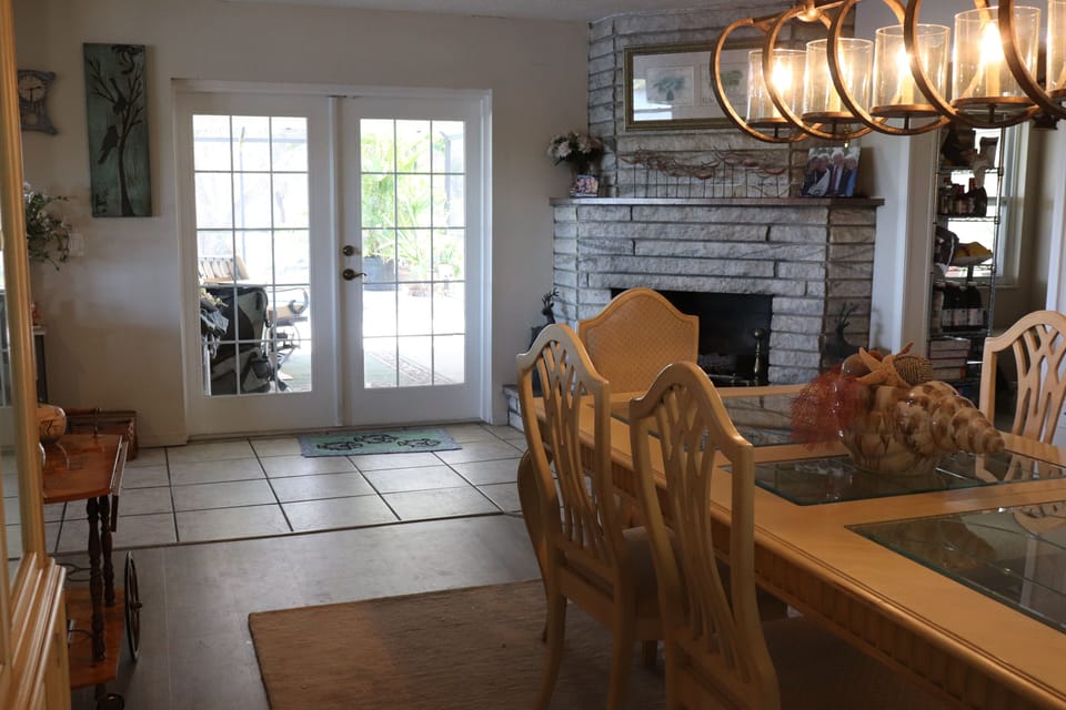 Dining room opens to the screened in pool.