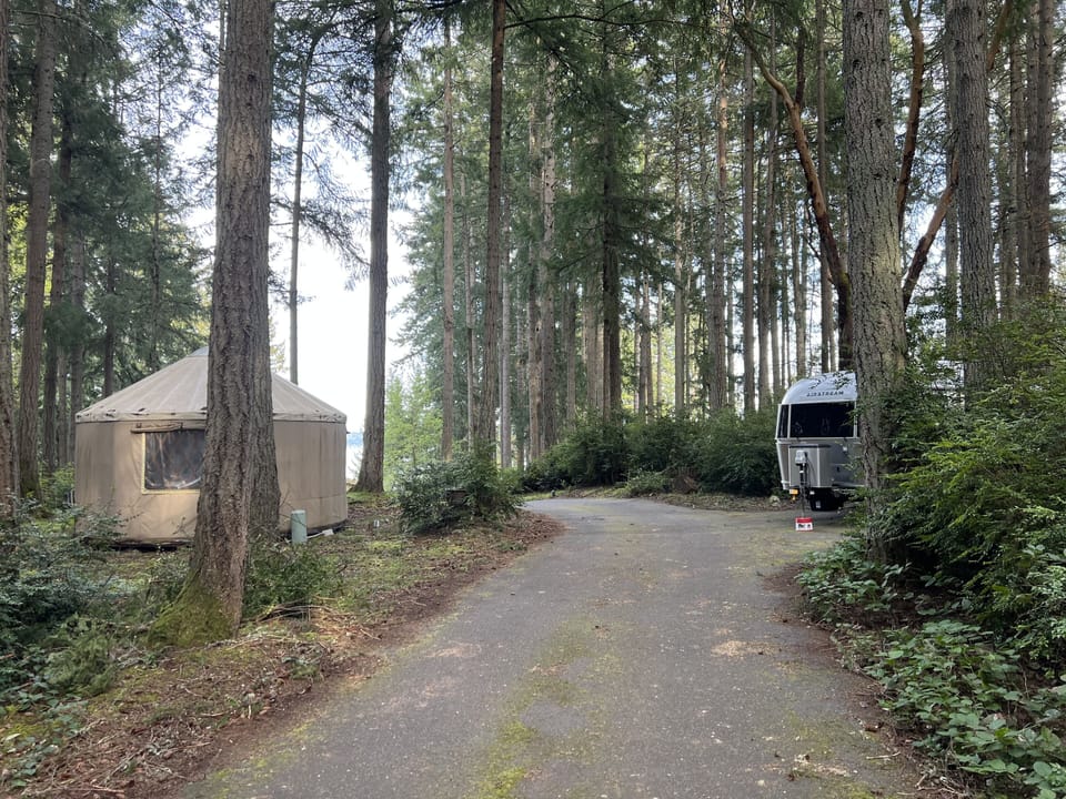 The yurt is across from an Airstream that could have other visitors present. 