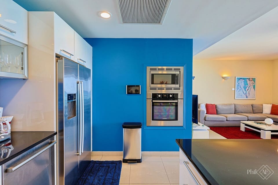 The kitchen is equipped with Bosch and Mielle appliances. 