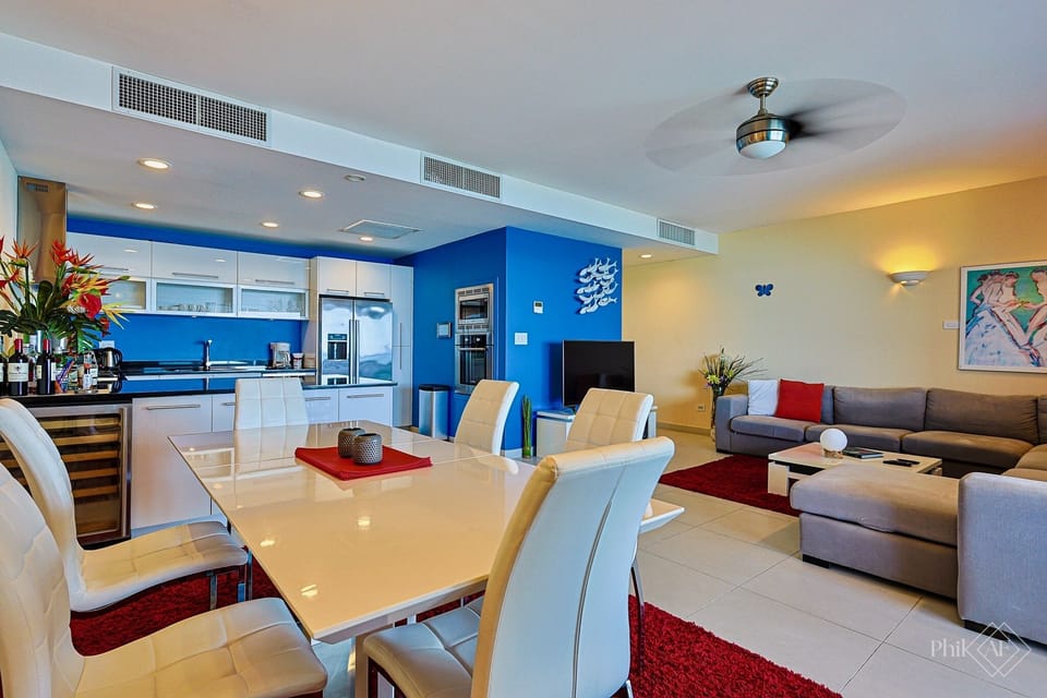 Full view of the kitchen, dining area and living room. The room is very spacious