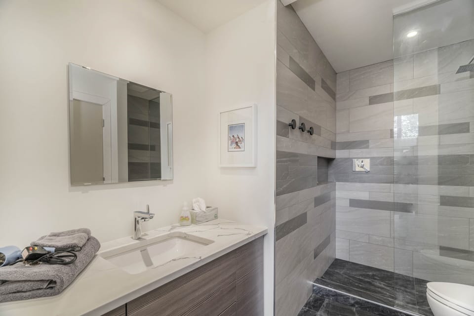 2nd Bath with rainfall shower and new stacked Washer/Dryer