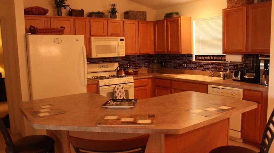 The kitchen boasts a new backsplash and is well equipped with all needed items!