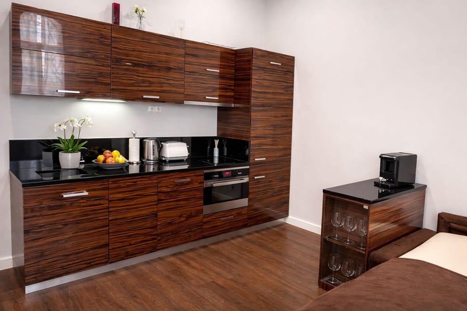 Modern fully equipped kitchen with premium appliances and coffee maker.