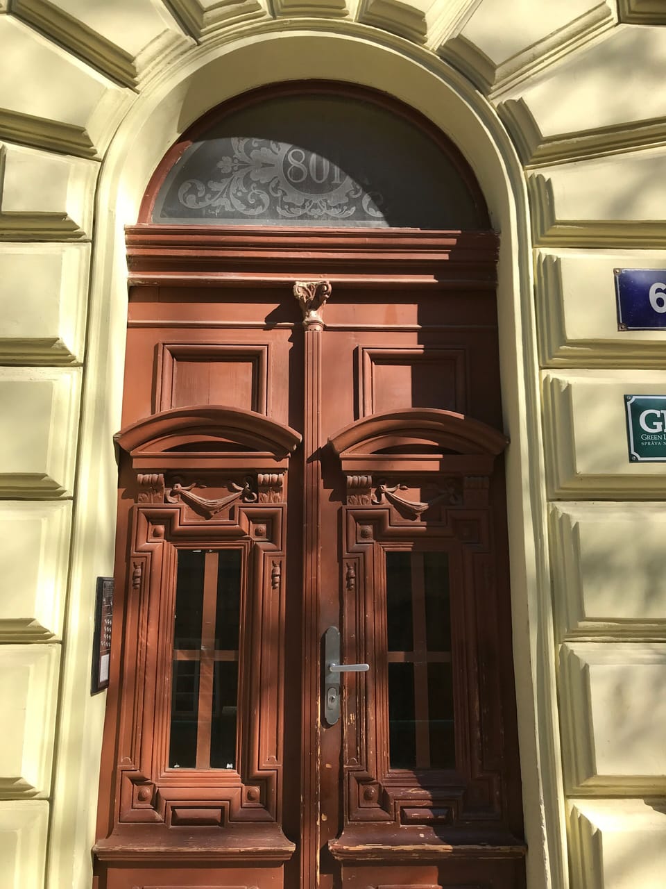 Historic Prague building entrance with elegant original architecture.