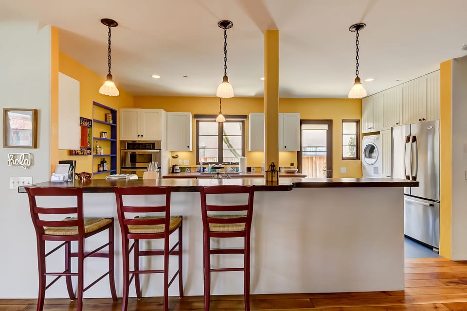 Bar seating to this special kitchen allows for more convenient dining while cooking.