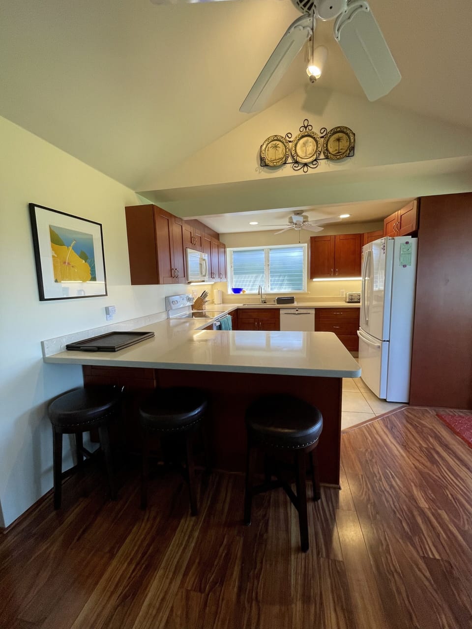 Spacious counter height space with 3 cushioned swivel stools for snacks or meals