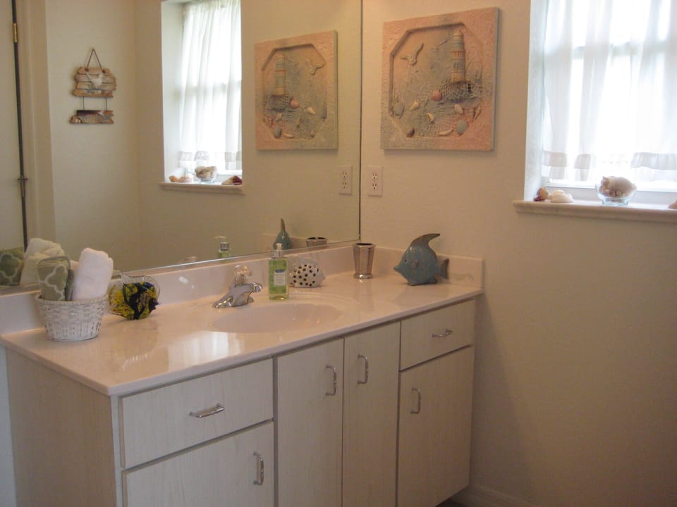 Master has twin vanities, a roman shower with rainhead and private toilet room.