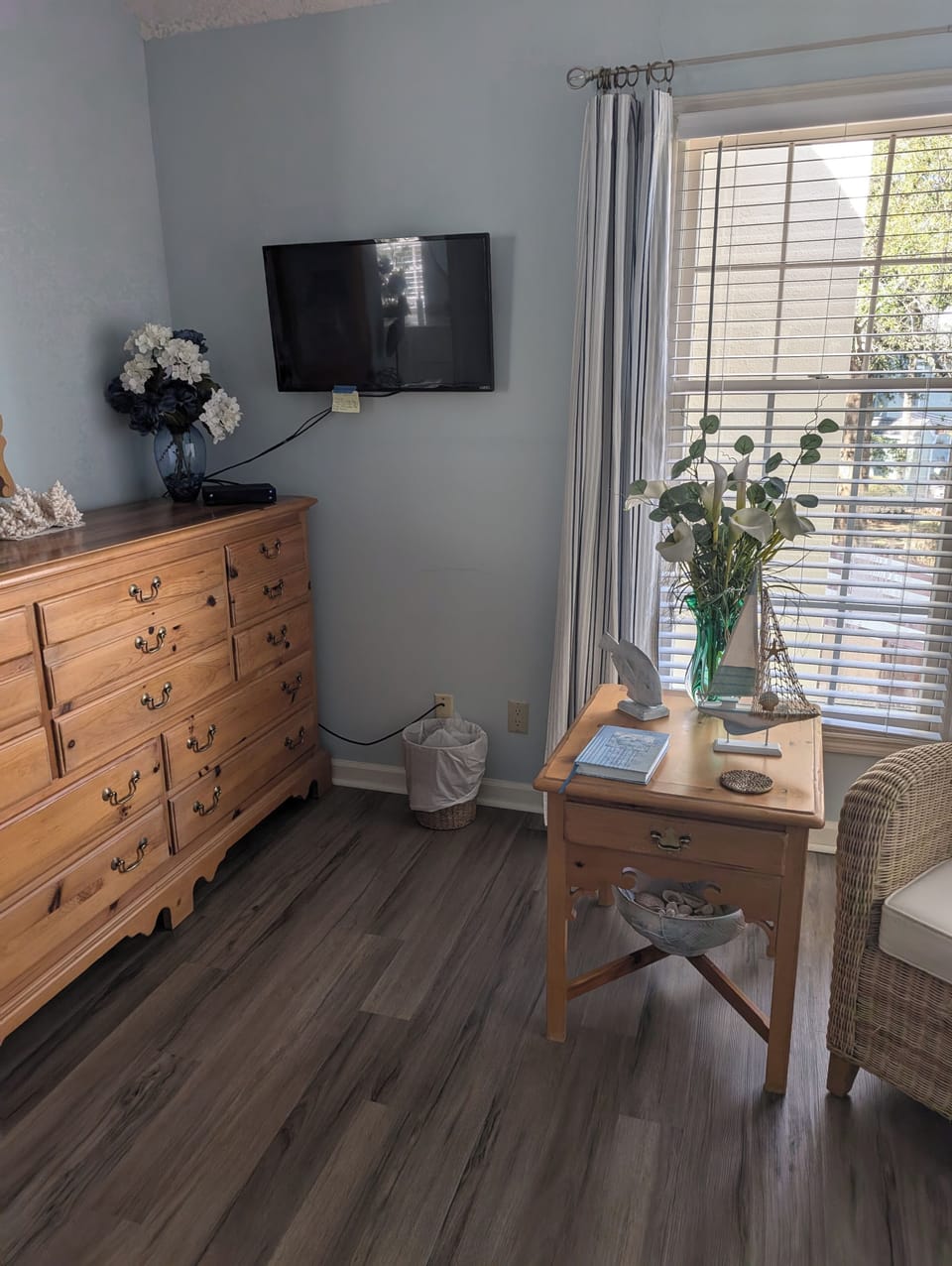 Master Bedroom with wall mounted TV, large dresser and walk in closet