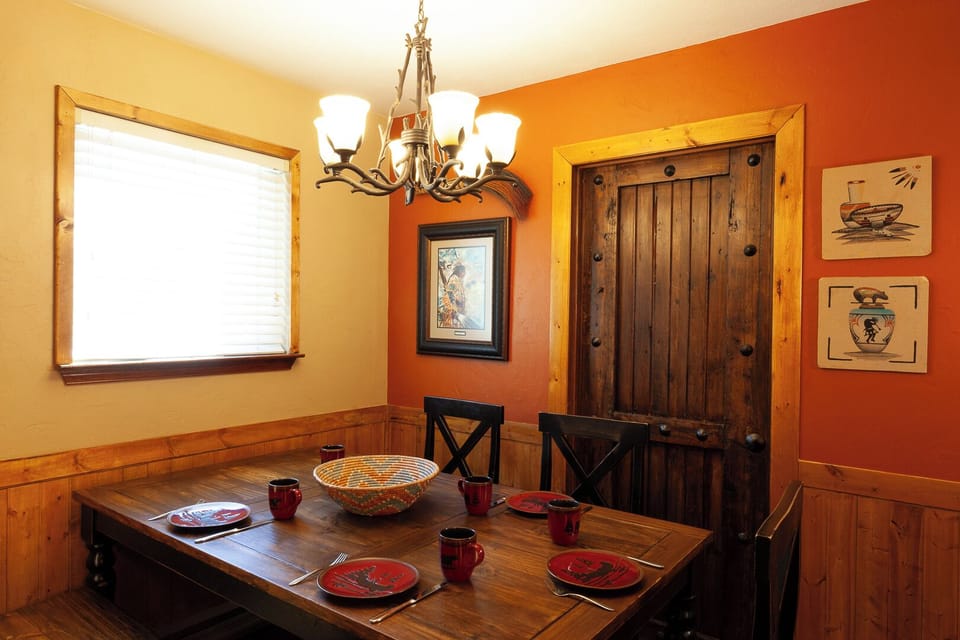 Gather around this cozy dining table where rustic charm meets warm hospitality. Morning coffee or evening meals feel special with thoughtful touches and inviting décor welcoming you home.
