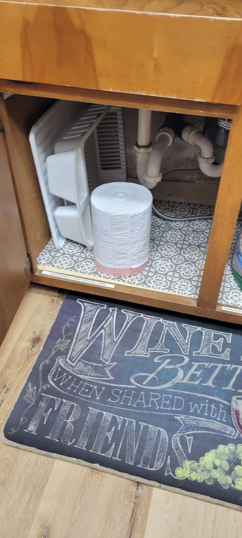 Under kitchen sink with ample supplies.