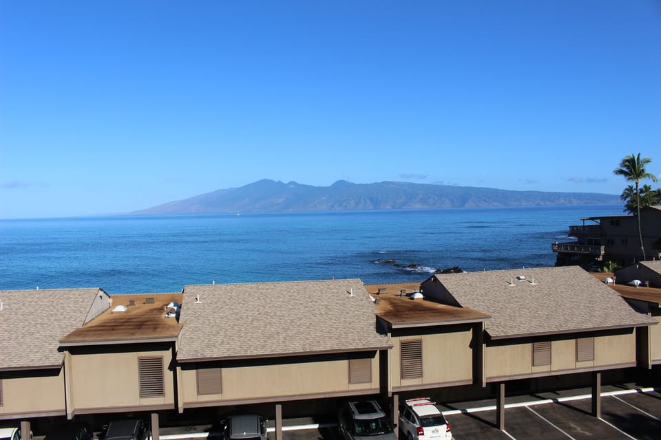 Daytime view from Master Bedroom lanai - view of ocean,  Molokai & Bldg F 
