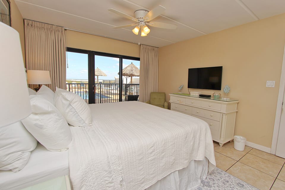 The Master Bedroom Features a Direct Refreshing  View of the Pool.