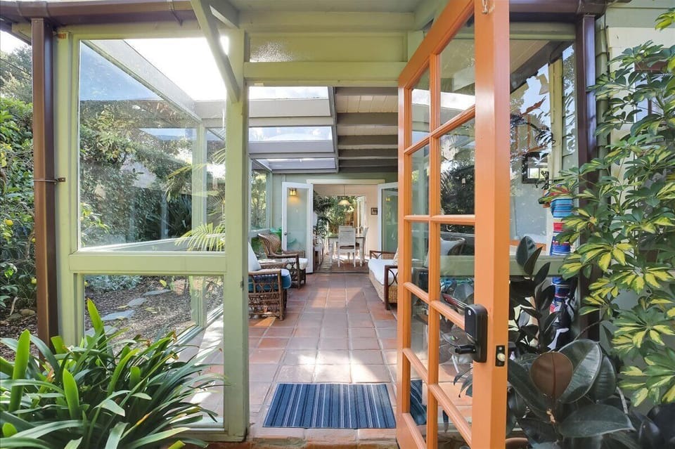 Sunroom with seating for 5.