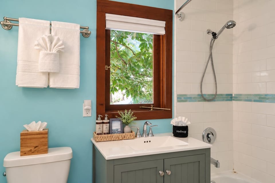 Bathroom with shower/bathtub combo and lots of amenities for guest to use.