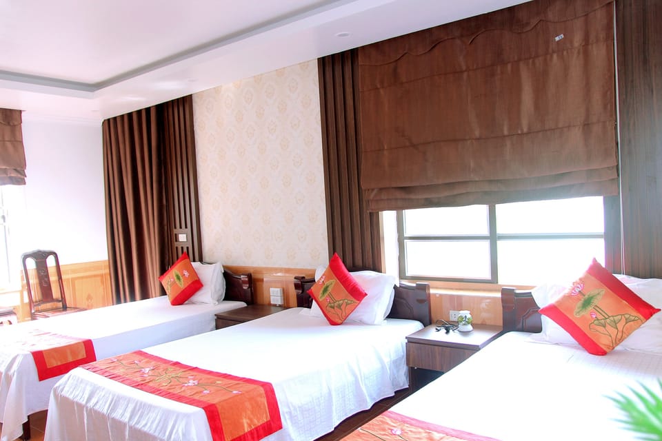 Triple Room | Desk, blackout drapes, free WiFi, bed sheets
