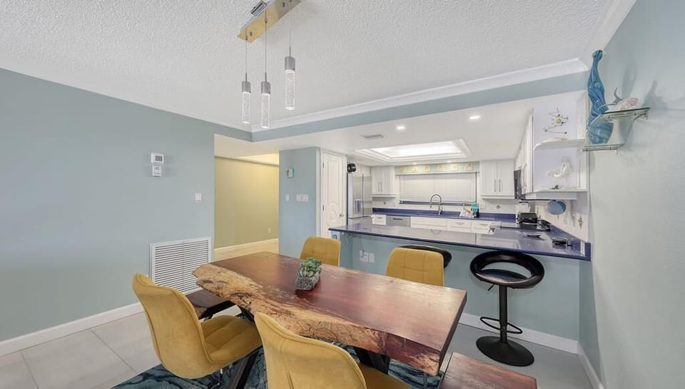 The kitchen opens into the dining area