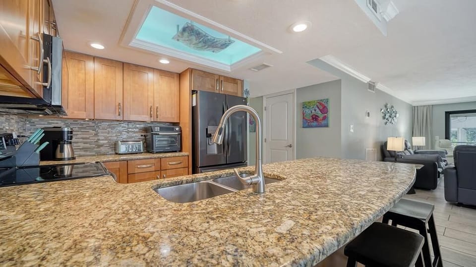Granite counters and custom lighting in kitchen