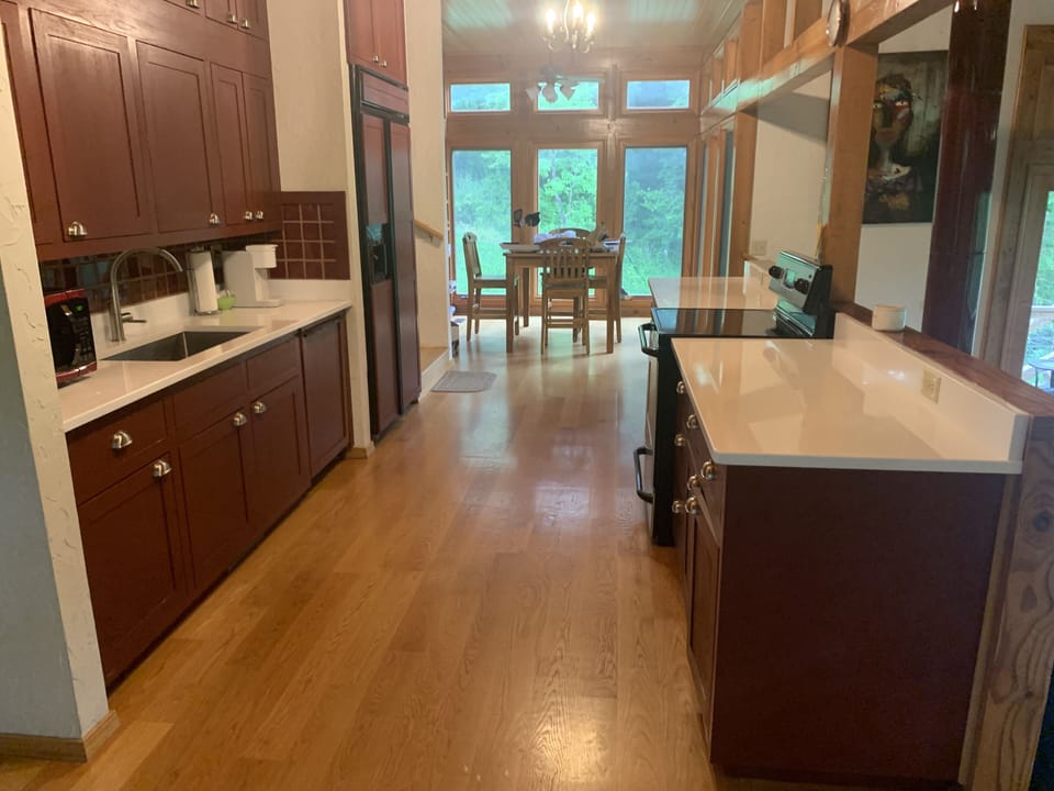 Updated kitchen with quartz counters and farmhouse sink.  Second dining area, 